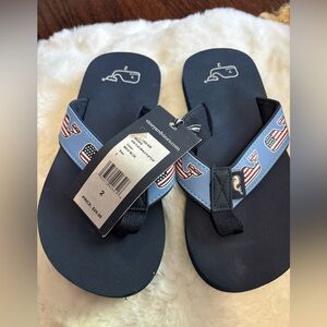 NWT. Vineyard Vines Navy Flip Flops with Whale Logo, size 2